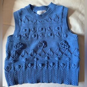 Blue knit vest, used once, as new.